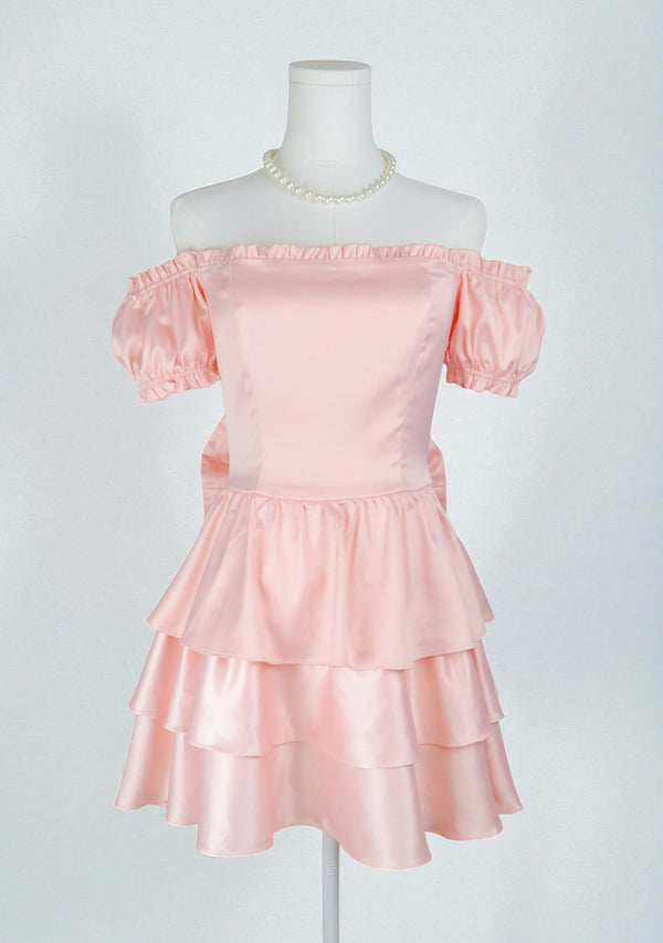 Blush pink girly dress with big bow and ruffles